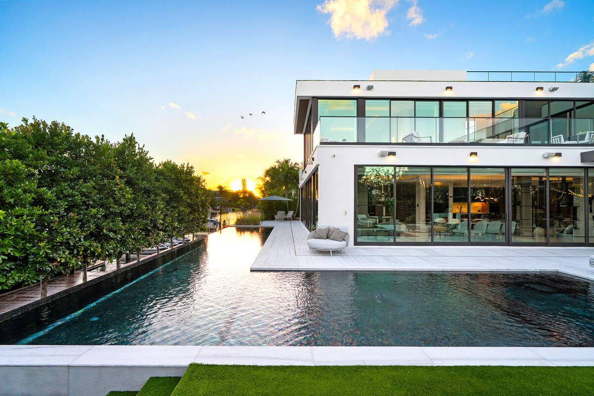 The home features a wraparound infinity pool.